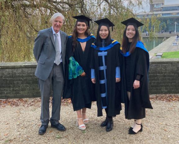 Students & professor at conferring